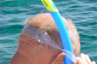 Snorkeling tours in Croatia: middle Dalmatian islands - tourist is ready to jump