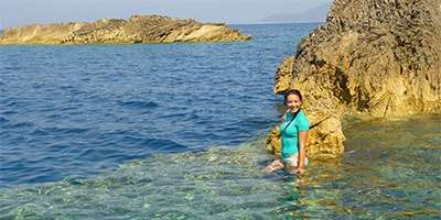 Ilirio's Three Caves Tour - swimming under the cliffs of Bisevo island